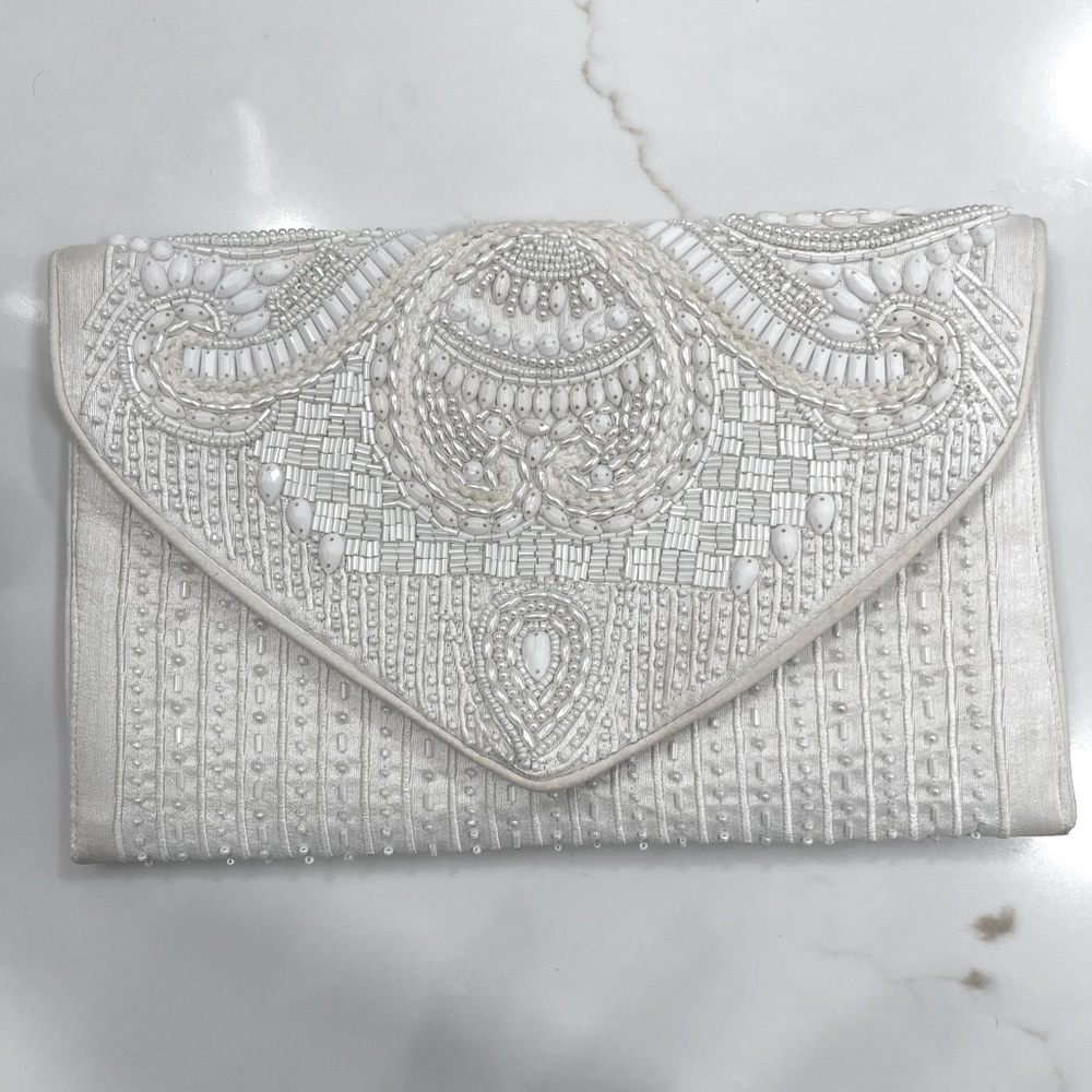 Lulu’s white beaded clutch